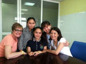 Nhu with her mom and MEDRIX staff after surgery