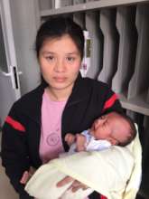 Mom with 23 day old child ready for surgery