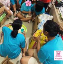 Packing 1-kilo bags of rice for food pantry