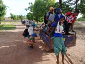 Students going to pass their exam using a tricycle