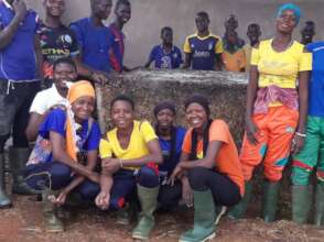 Happy students in front of the compost pile