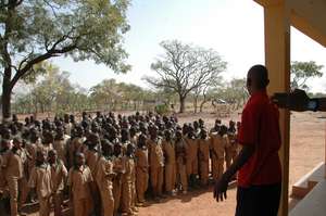 School director speaking to the Lap students.