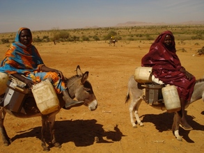 Women taking their new cookstoves home