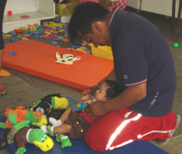 A father practicing his new skills with his baby