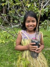 A student with her fruit trees in Peru