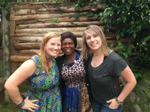 Jennipher (center) with two visitors in Uganda