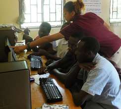 Volunteer Bree H. teaching computer skills
