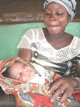 A mom & her healthy baby at the Imani House clinic