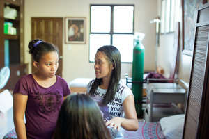 Ann working with Mercy In Acton Midwife