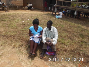 Nurse counselor talking a father about PMTCT