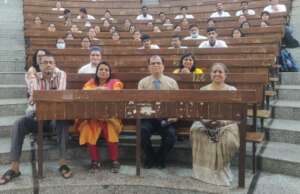 With the faculty and a section of students