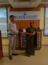 Receiving a memento from the Consultant Dr Arun