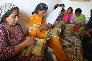 Sughar Women learning embroidery skills in Center