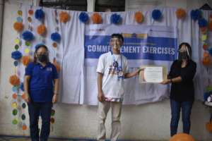 Michael is happy to receive his certificate