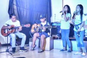 Street children sing popular songs