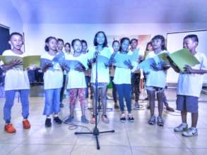 Street children sing Christmas carols