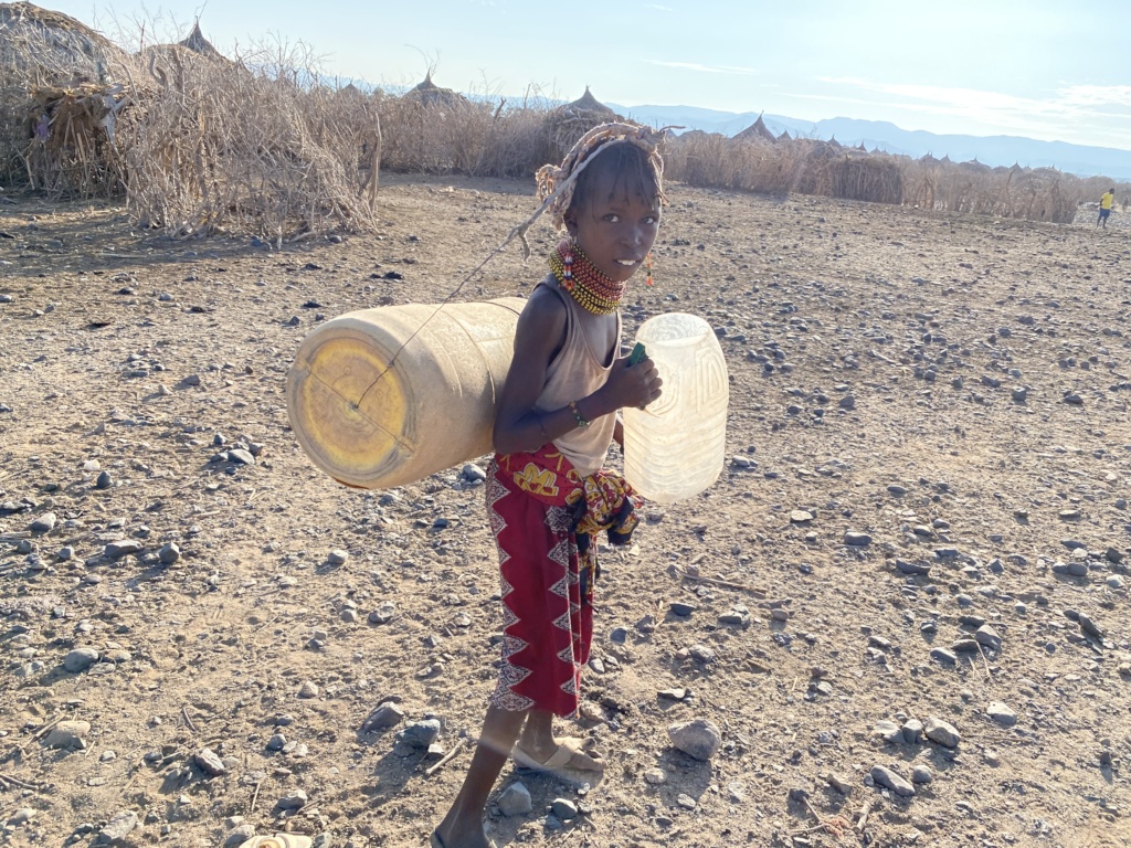 A girl going to fetch water 16Kms from home.