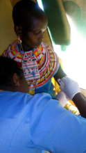 Nalimu as she receives her implant