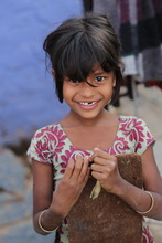 always watching as we passed her house in the slum