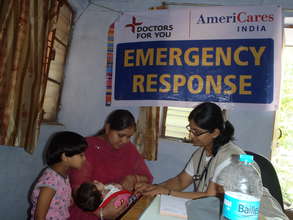 AmeriCares doctor tending to a sick infant