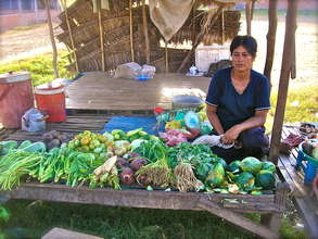 A woman at her new produce stand