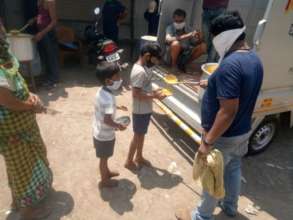 Cooked meal getting distributed at one of our site