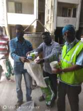 Our builder distributing dry ration to workers