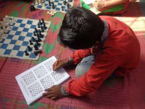 Child engrossed in learning the techniques of play