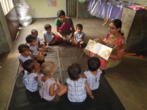 Teacher sharing stories to creche children