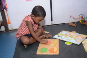 Creche Child exploring puzzle