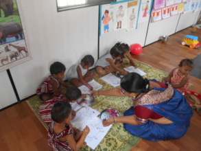 children at our centre doing collage work !