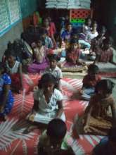 Children practice yoga on Yoga day