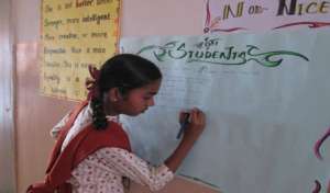 Student writes in the chart - 2