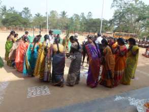 Singing and dancing around the Pongal arrangement