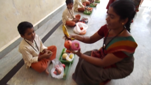 Students making sounds enacting market vendors