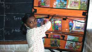 Student with her new found interest with books!