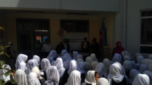 Girls receiving learning materials in Kabul