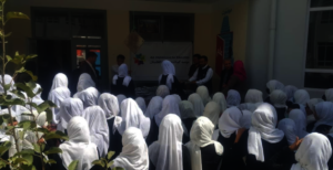 Students receiving stationery packages