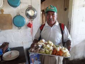 Cooking healthy vegetables for his extended family