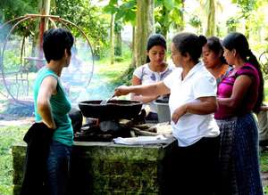 Cooking at project celebration in the local park