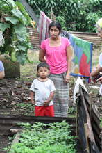 Proudly telling how her son helps in the garden