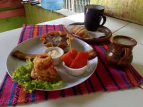 Typical breakfast includes eggs w/ tomato & greens