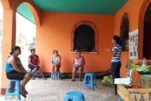 A small group gathers for learning at a neighbor's