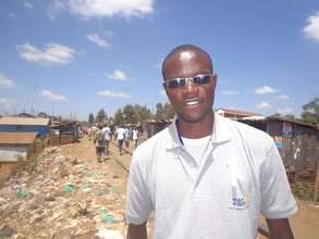 George Waweru in Kibera gathering video reports