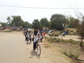 Girls riding back after school