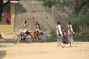 Showing off their bikes as they come home
