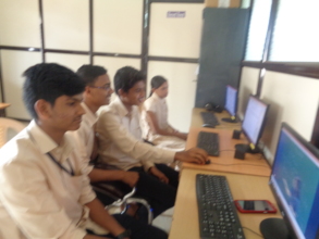 Students using computer in learning center