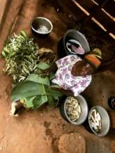 mama jamira cooking for everyone at the clinic
