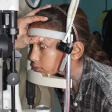 Junita undergoing initial eye examination