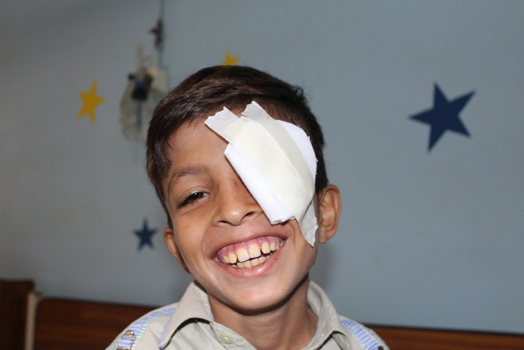 Child smiling after surgery